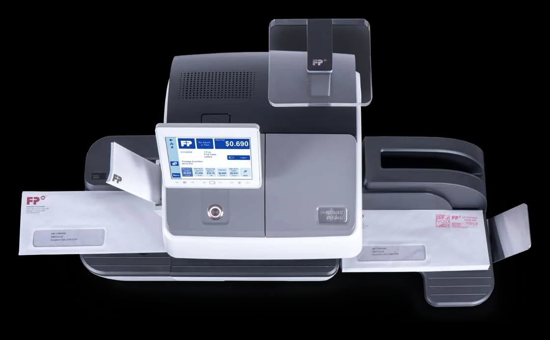 FP PostBase Fusion postage meter with an envelope feeding through